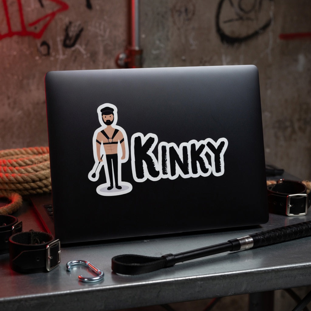 Kinky Bubble-Free Sticker with BDSM figure on laptop, surrounded by handcuffs, rope, crop, leather restraints