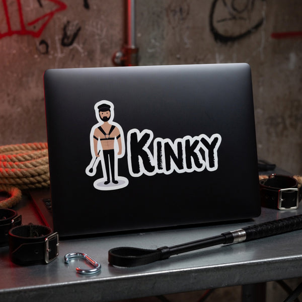 Kinky Bubble-Free Sticker with BDSM figure on laptop, surrounded by handcuffs, rope, crop, leather restraints