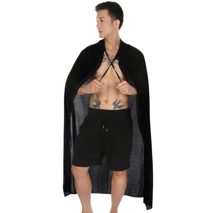 Front-view model wearing a long black sheer cape over black shorts, holding it open