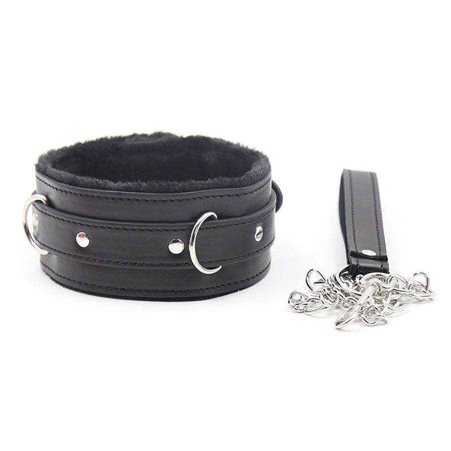Black faux-leather bondage collar with fur lining, metal rings, and a detached chain leash