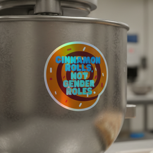 Holographic vinyl sticker with “Cinnamon Rolls Not Gender Roles” in bold blue, cartoon cinnamon roll, playful queer flair.