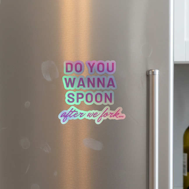 The Do You Wanna Spoon After We Fork holographic sticker, in bold purple, teal, and pink playful fonts, pops on a metallic fridge; white cabinet and wine bottle sit to the right.