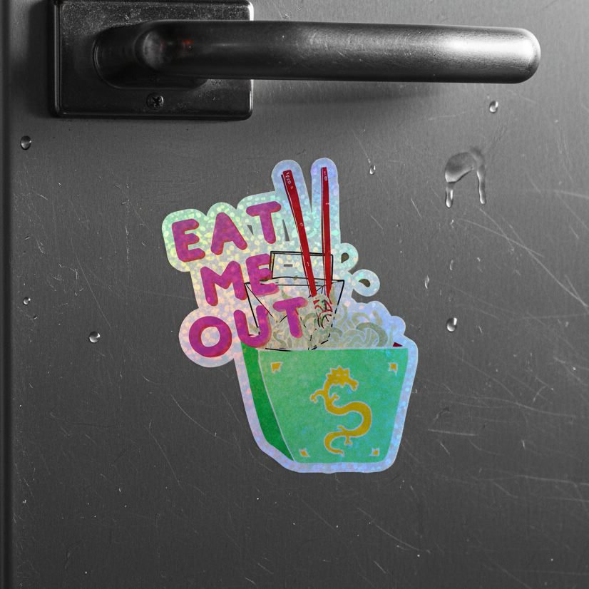 Holographic sticker with “EAT ME OUT” above a green noodle takeout box, red chopsticks, yellow dragon, rainbow vinyl shimmer.