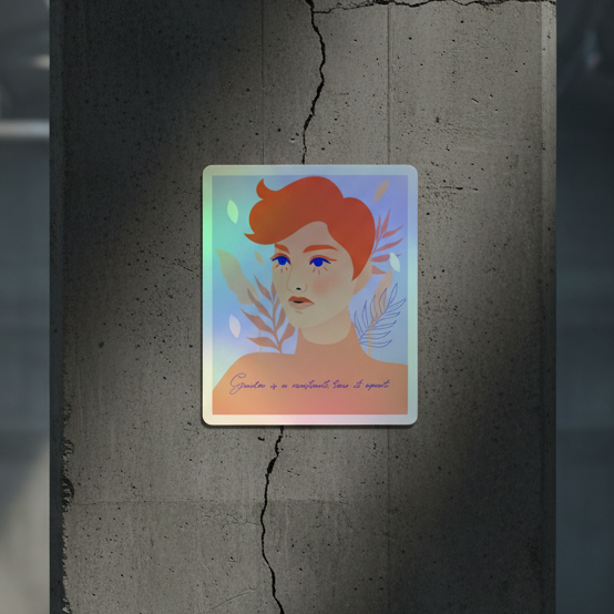 Square art print featuring a bold, short red-haired portrait with leafy vibes, “Gender Is A Construct Tear It Apart” holo stickers, and cursive: “Growth is a nonlinear line of growth.”.