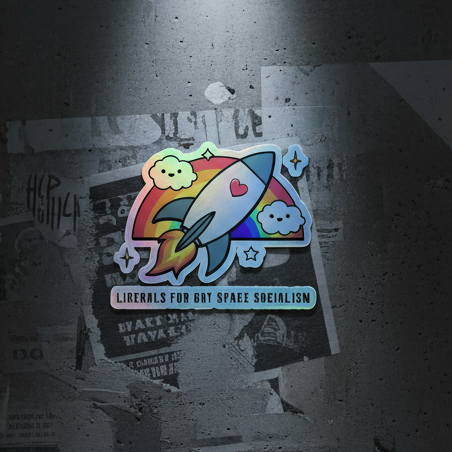 Holographic sticker showing a flashy rocket with rainbow flames, clouds, stars, a heart, and the slogan "Liberals FOR GAY SPACE SOcIALISM".