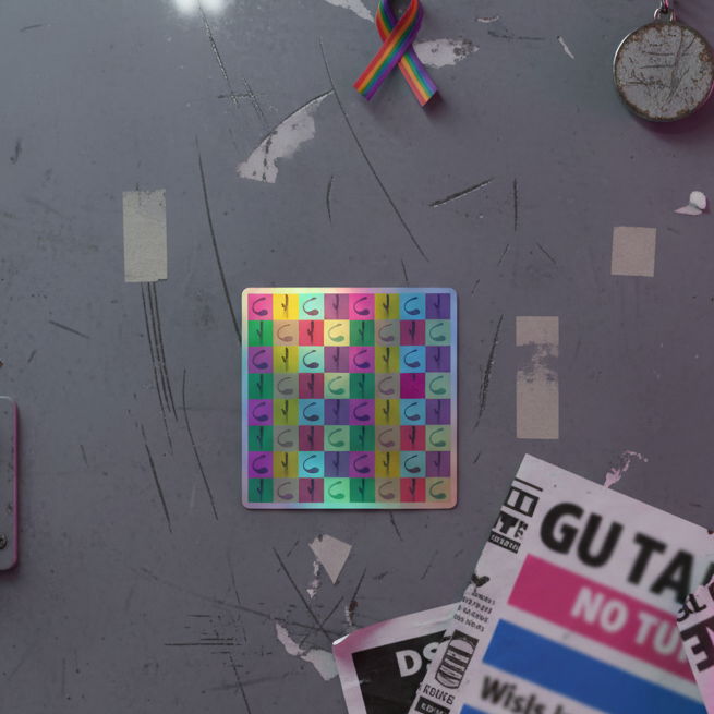 Holographic pop art vibrator sticker with abstract patterns on scratched gray, surrounded by tape, rainbow ribbon, metal keychain, and bold black-and-pink clippings.
