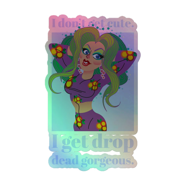 Glamorous I Get Drop Dead Gorgeous holographic sticker featuring a vibrant drag-queen persona with striking makeup and sunflower-patterned outfit, celebrating queer pride and self-expression.