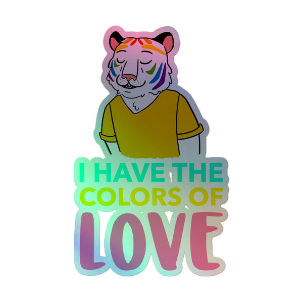 Anthropomorphic tiger with pink fur and rainbow stripes, wearing a mustard V-neck, embodies I Have The Colors of Love slogan, representing Queer Holographic Stickers celebrating LGBTQIA+ pride and self-expression.