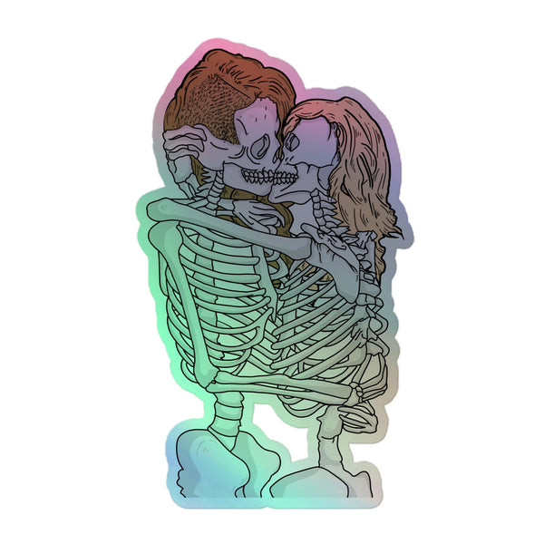Queer Skeletons Holographic Stickers feature two skeletons in a loving embrace, outlined in black. The hot-embossed vinyl shimmers with a rainbow effect, celebrating pride and self-expression.