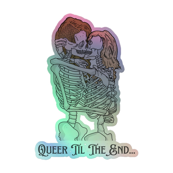 Queer Til The End Holographic Sticker: Two skeletons in a pastel embrace with a Queer ’Til The End slogan. Vibrant, durable vinyl celebrates queer pride, self-expression, and inclusivity with a shimmering, electrifying rainbow finish.