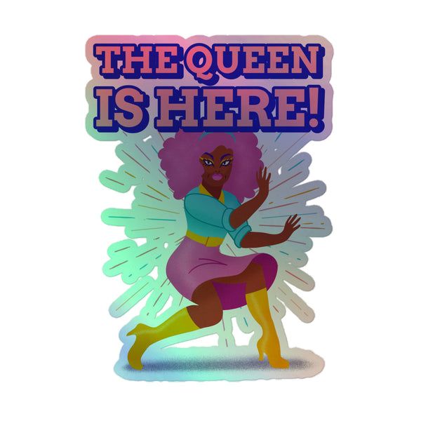 The Queen Is Here Holographic Stickers feature a bold illustration of a drag-inspired figure with a purple afro and vibrant outfit, capturing queer pride and self-expression with a shimmering, rainbow holographic design.