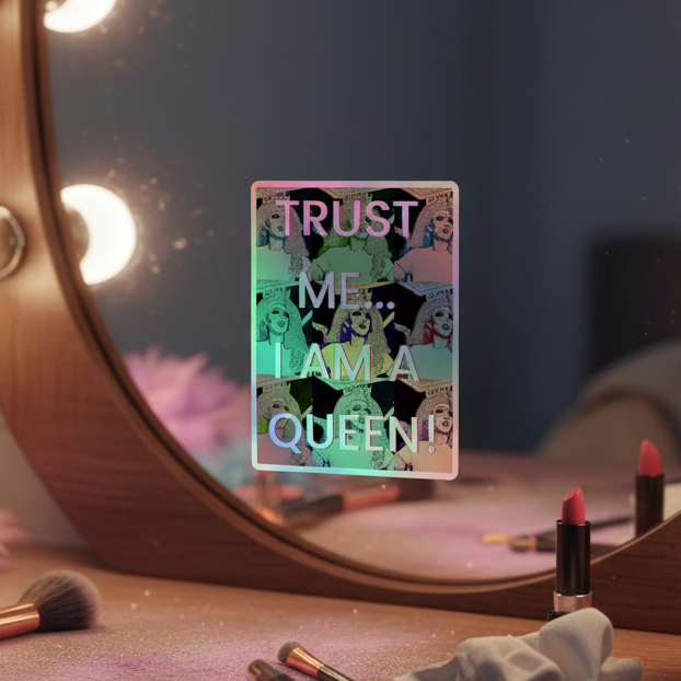 Trust Me I’m A Queen holographic stickers pop with queer pride by a neon “TRUST ME I AM A QUEEN” mirror over makeup, bathed in soft bulb light.