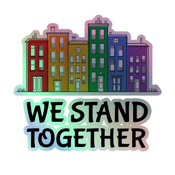 We Stand TogeTher Holographic Stickers feature six rainbow-colored row-houses with WE STAND TOGETHER text, celebrating queer pride and self-expression with a vibrant, durable vinyl design.