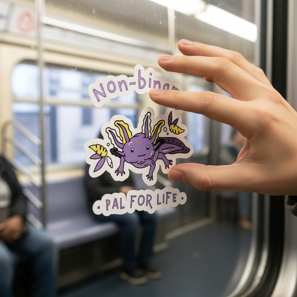Non-Binary Pal For Life bubble-free sticker with a purple axolotl, yellow gills, “Non-binary” above, “Pal for life” below.