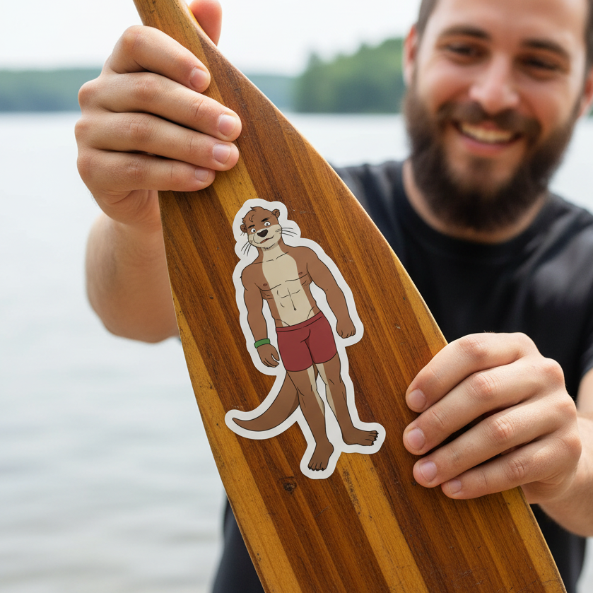 Gay Otter Bubble-Free Sticker on a wooden paddle, with a cute otter in red trunks and green wristband; bearded man by a lake.