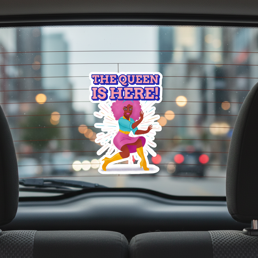 Bubble-free sticker on high-opacity vinyl shows a bold woman dancing, with "THE QUEEN IS HERE!" in blue and purple text.