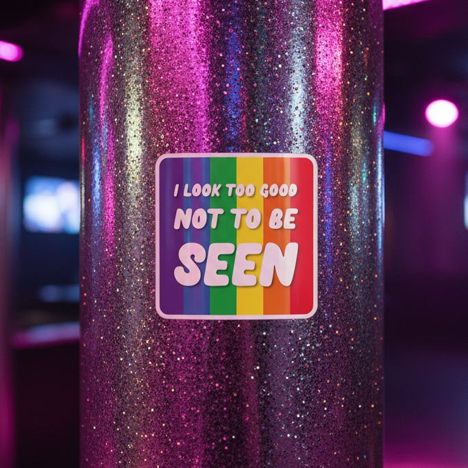 “I Look Too Good Bubble-Free Sticker” in bold, playful type is stuck to a glittery pole, backdropped by blurred pink and purple club lights.