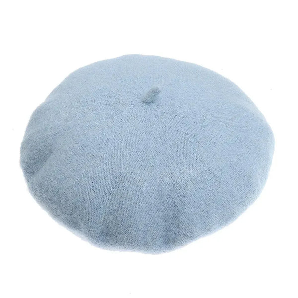 Close-up of a light blue wool-look beret with a small center crown detail