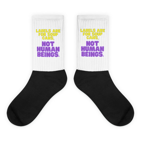 Labels Are For Soup Cans Socks feature a bold black foot and a ribbed white leg with vibrant yellow and purple text