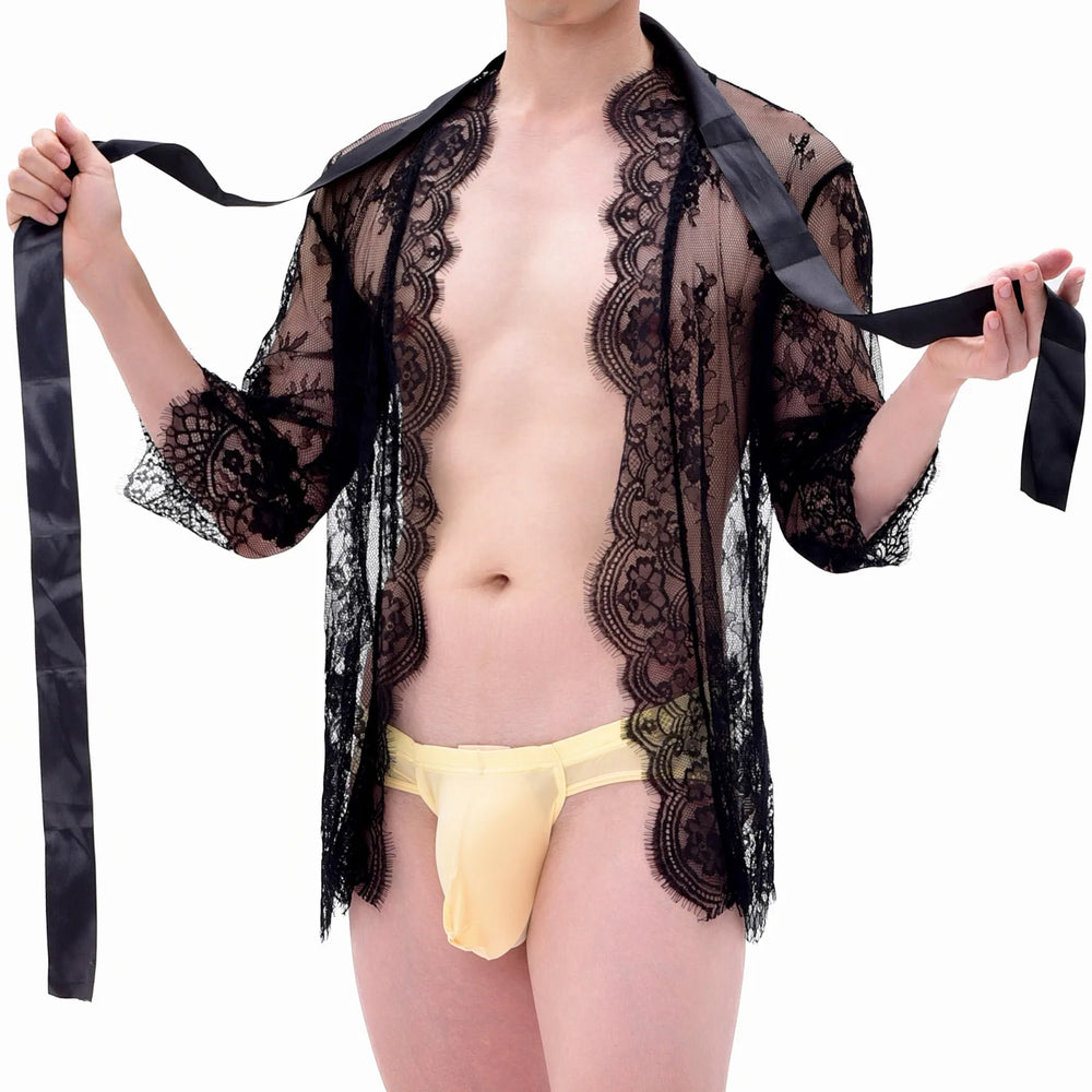 Front view of a person wearing a sheer black lace kimono over a yellow thong