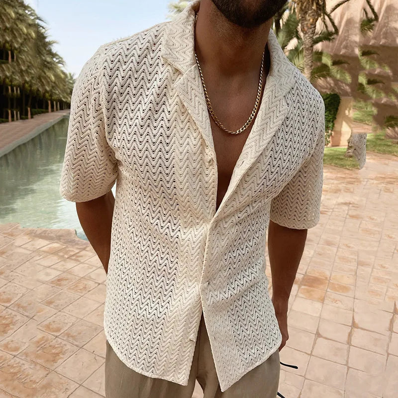 Cropped model wearing an ivory zigzag lace shirt with an open front by a pool