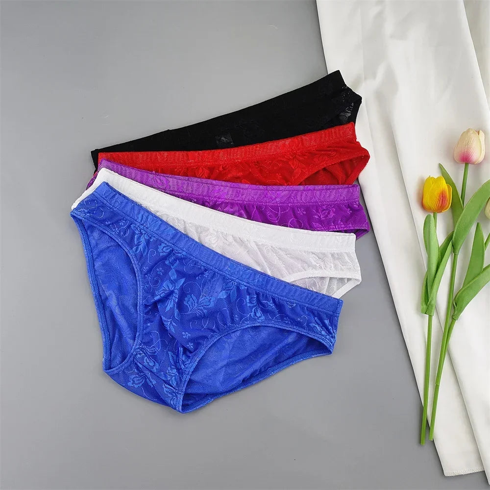 Flat lay of five lace briefs in black, red, purple, white, and blue