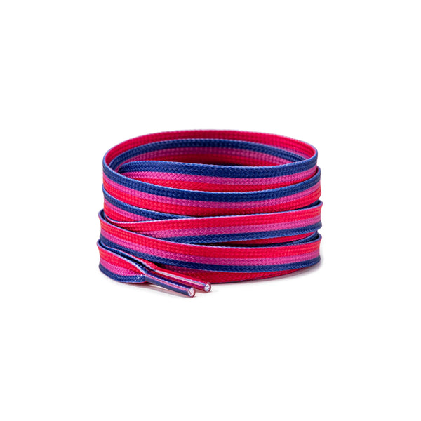 Coiled navy, pink, and magenta shoelaces with two capped ends visible on white