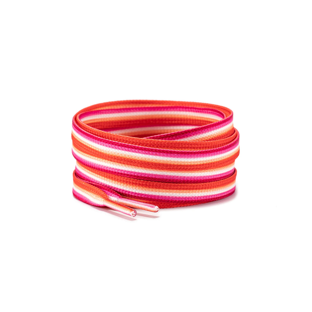 Coiled pink, orange, and white striped shoelaces with two capped ends on a white background