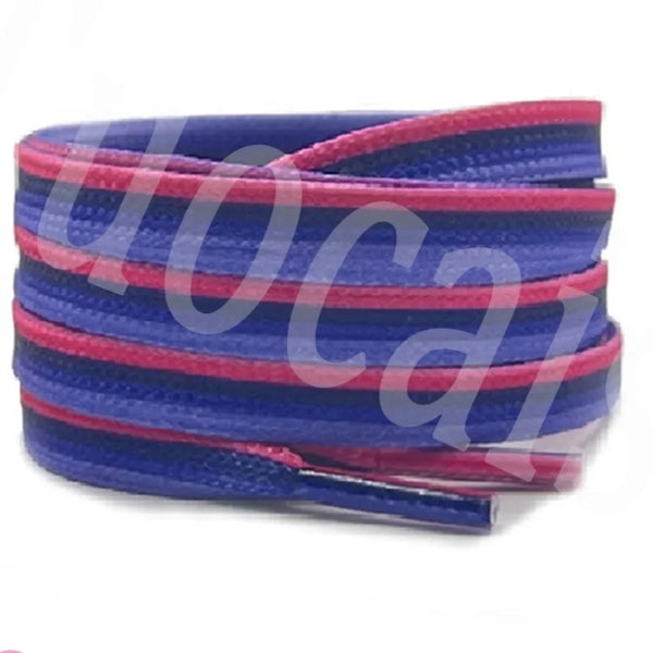 Coiled blue and pink flat shoelaces shown against a white background