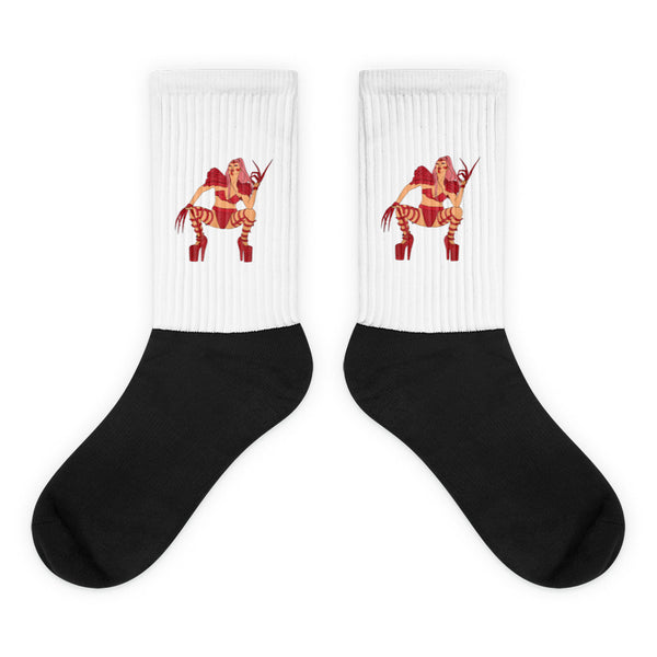 Pair of black-and-white crew socks with red illustrated figures on the ribbed cuffs
