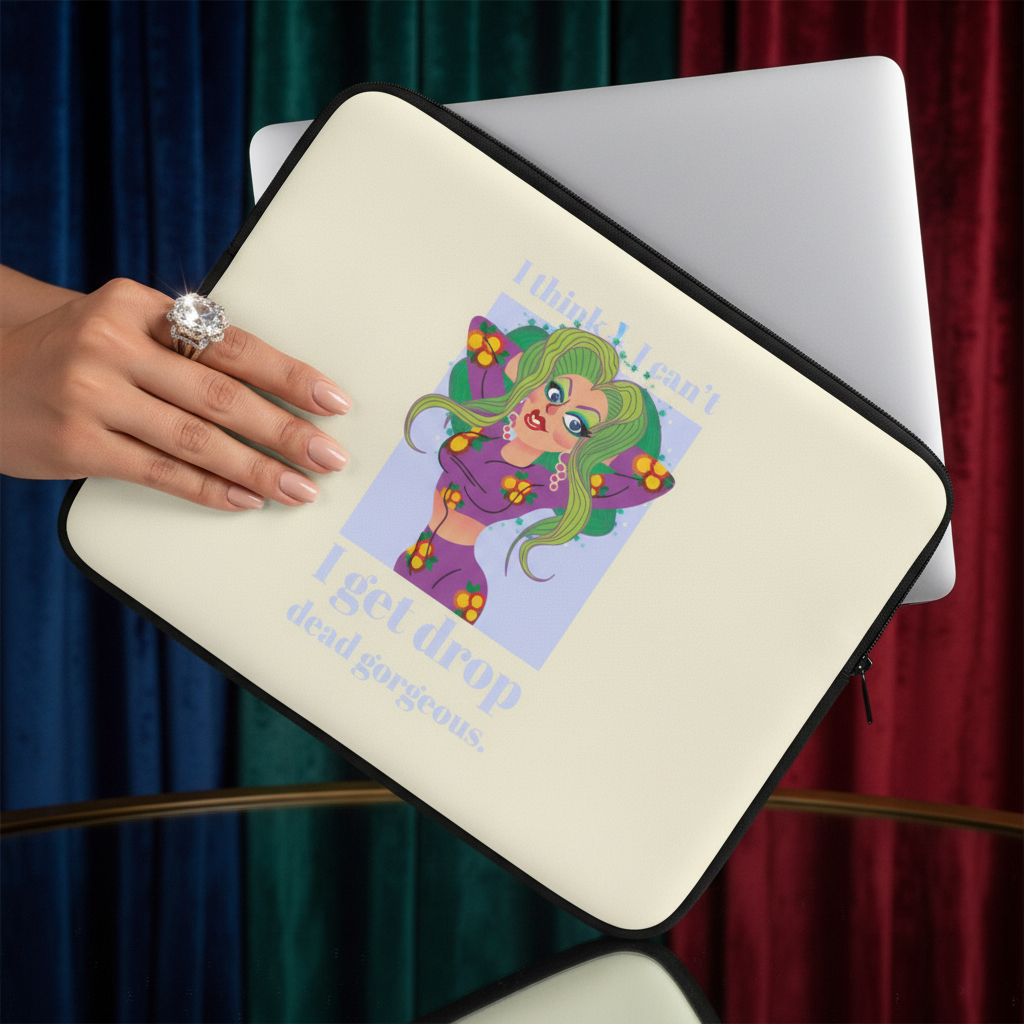 Cream-colored laptop sleeve with “I think I can't get drop dead gorgeous,” cartoon femme with green hair, silver laptop, bold curtain colors.