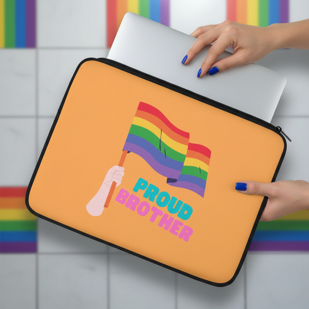Proud Brother Laptop Sleeve with rainbow stripes, a hand holding a pride flag, "PROUD BROTHER" text; blue-nailed hand shown.