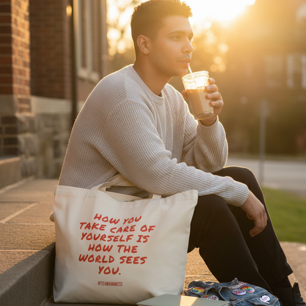 In a sunlit street scene, a person carries an organic tote reading “How you take care of yourself is how the world sees you.”