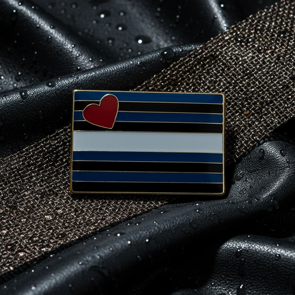 Leather pride enamel pin with black, blue, and white stripes and a red heart