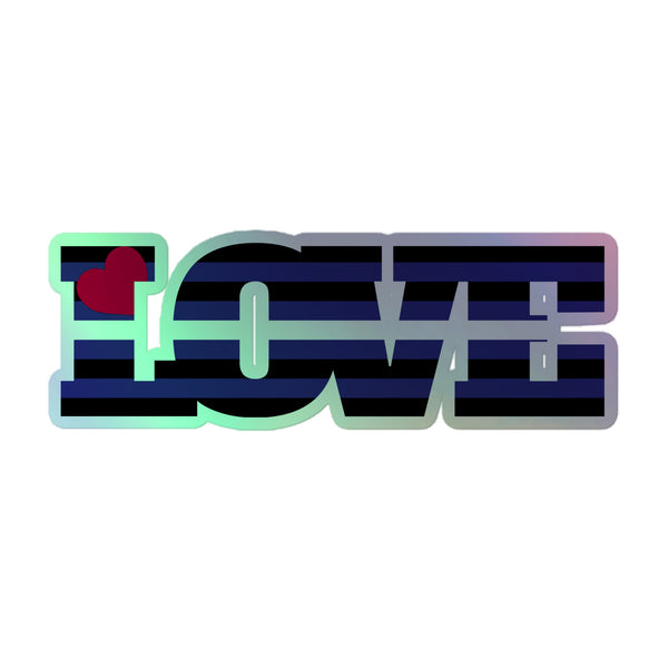 Flat-lay holographic sticker spelling LOVE in black and blue stripes with a red heart