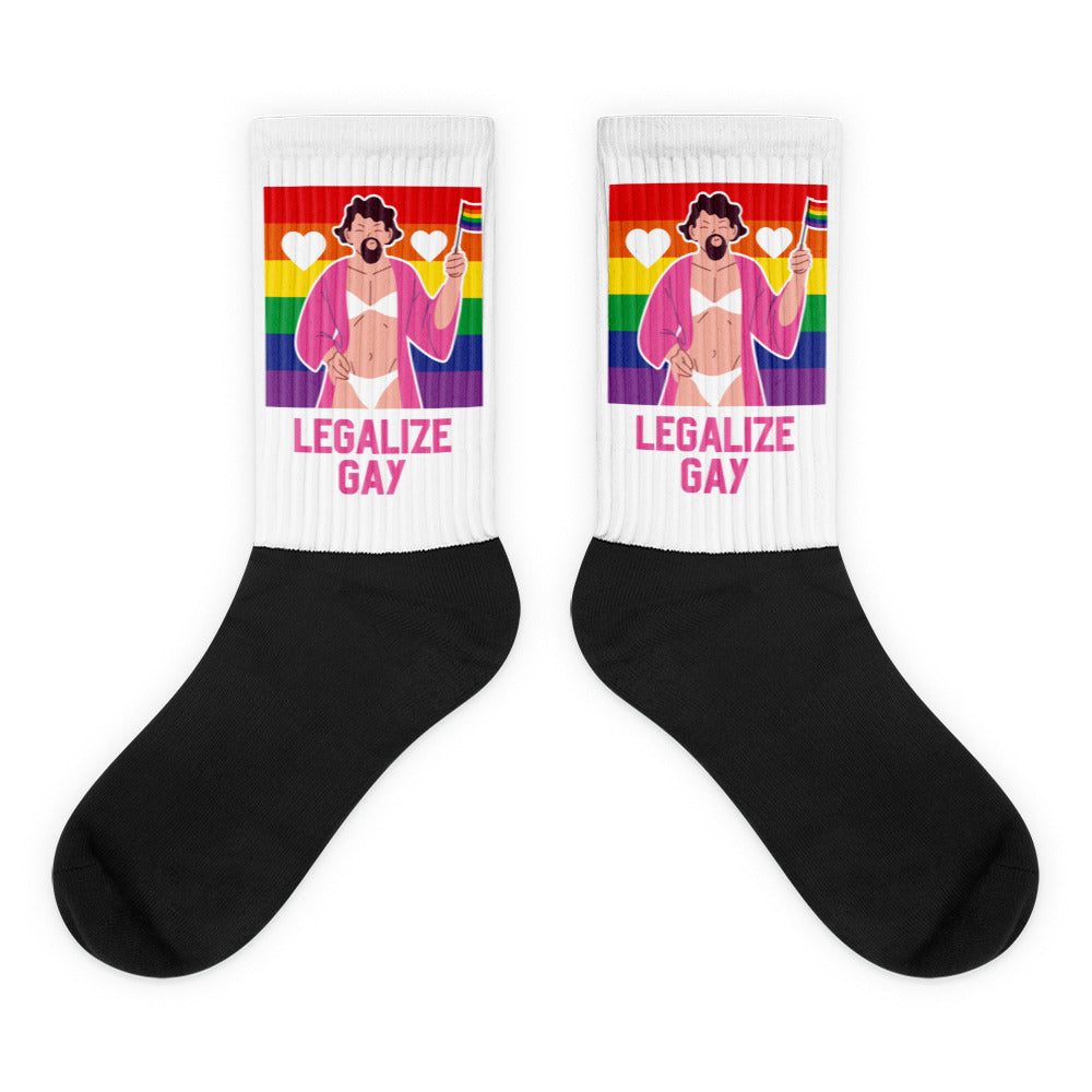Pair of black crew socks with rainbow panels, a bearded figure, and “LEGALIZE GAY” text
