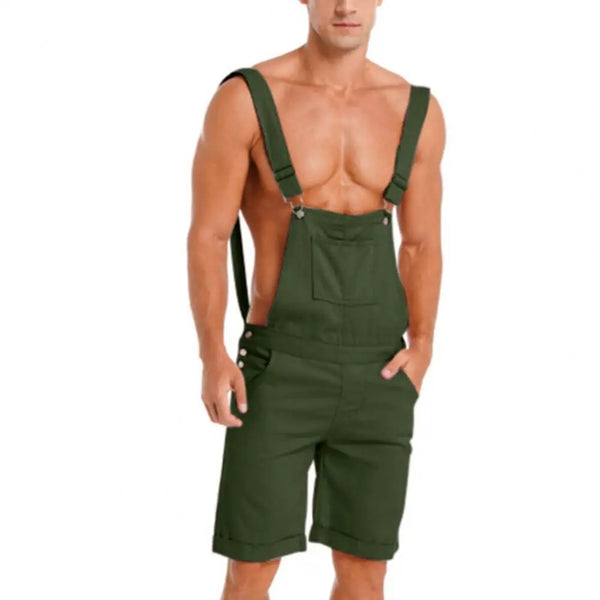 Front view of a shirtless person modeling dark green bib overalls with shorts and pockets