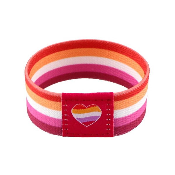 Striped lesbian pride wristband with a heart-shaped rainbow patch, shown upright against white