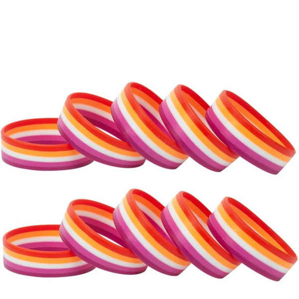 Two rows of multicolored lesbian pride rubber wristbands, shown at an angle on white