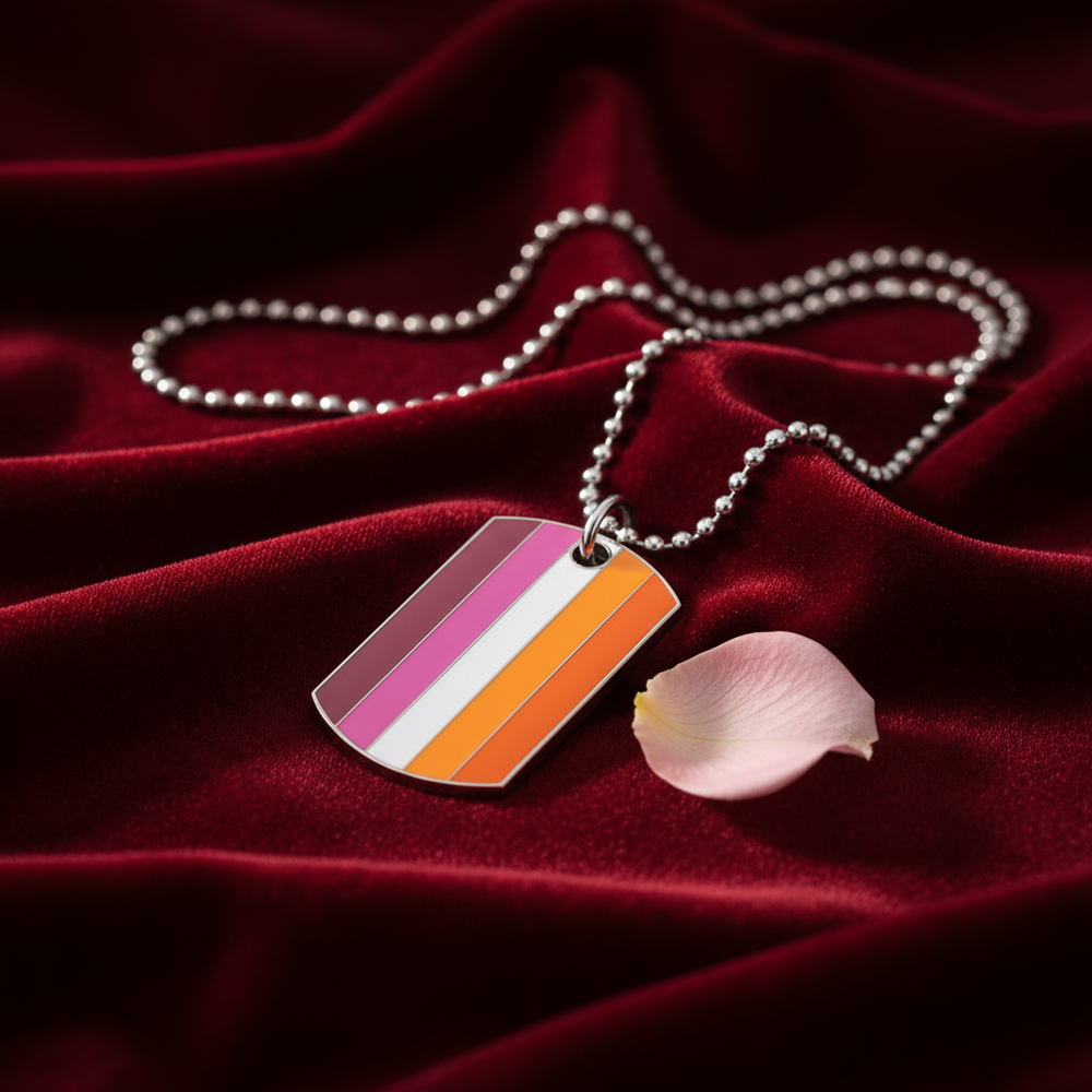 Lesbian Pride striped dog-tag pendant on a ball chain over red velvet