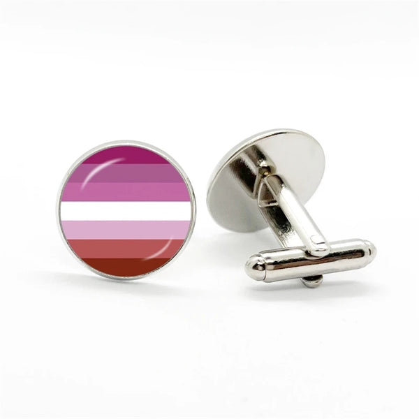 Pair of round silver cufflinks, one showing pink, white, and red horizontal stripes