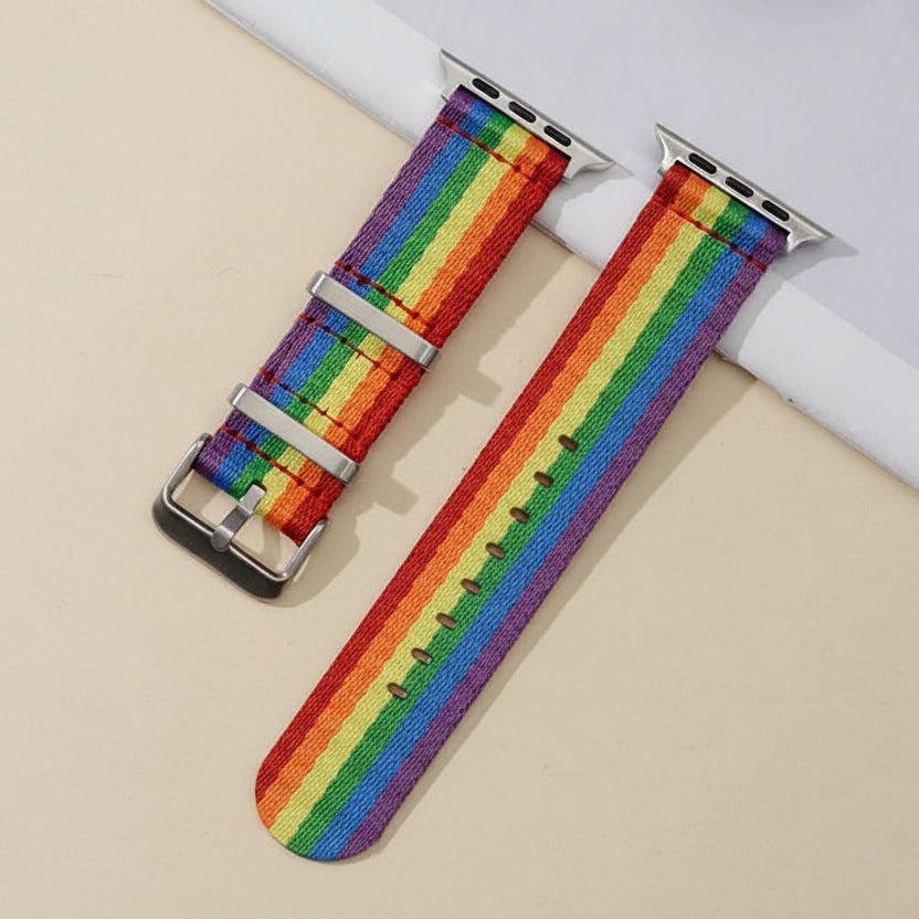 Rainbow Pride Apple Watch band with silver connectors and buckle, shown flat