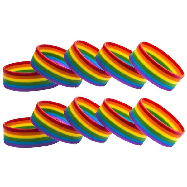 Ten rainbow-striped rubber wristbands arranged in two overlapping rows on white