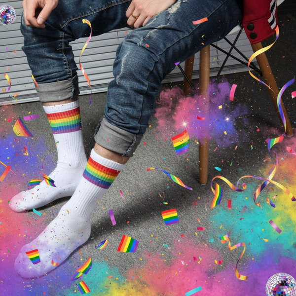 LGBT Pride Thick Cotton Socks in rainbow colors peek out from ripped jeans as confetti, glitter