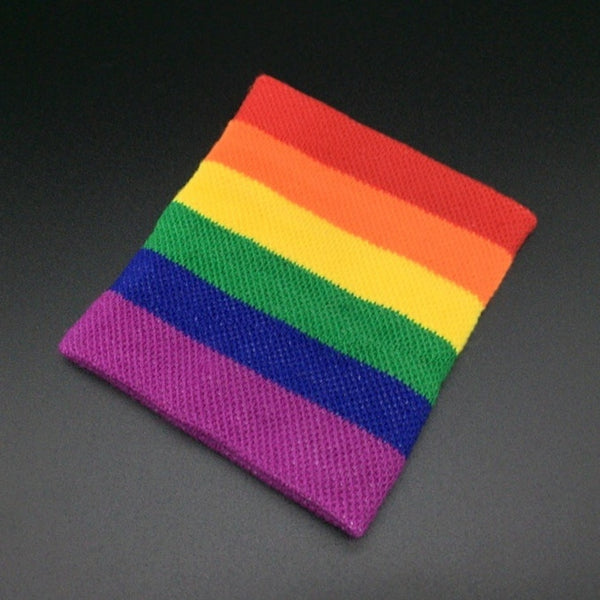 Flat-lay rainbow Pride wristband with red, orange, yellow, green, blue, and purple stripes