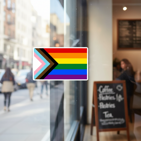 LGBT Progress Pride Flag bubble-free sticker on a glass window, with city street, folks walking