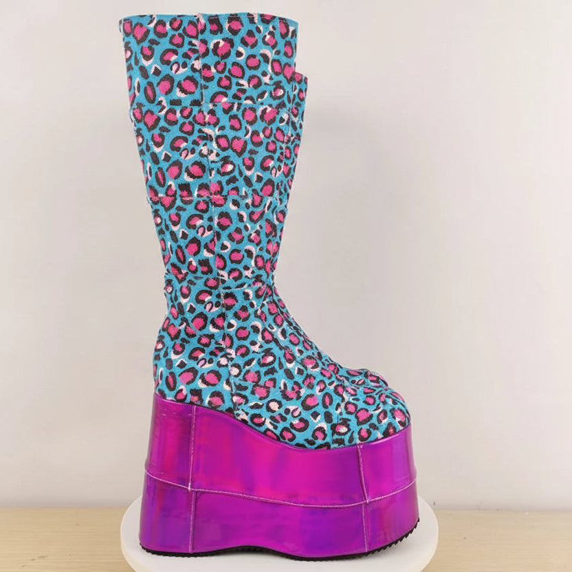 Side view of a turquoise and pink leopard-print platform boot with a tall magenta sole