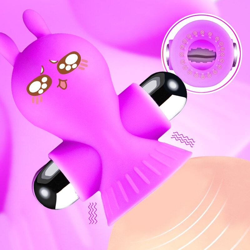 Purple rabbit-shaped vibrating nipple clamp with black-and-white rounded ends, shown over skin