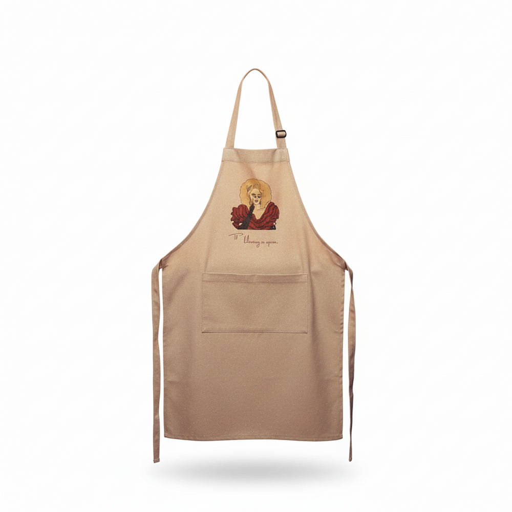 Front view of a tan apron with a RuPaul illustration, neck strap, pocket, and waist ties