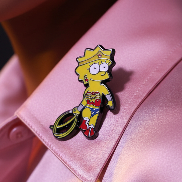 Lisa Simpson dressed as Wonder Woman enamel pin on a pink satchel